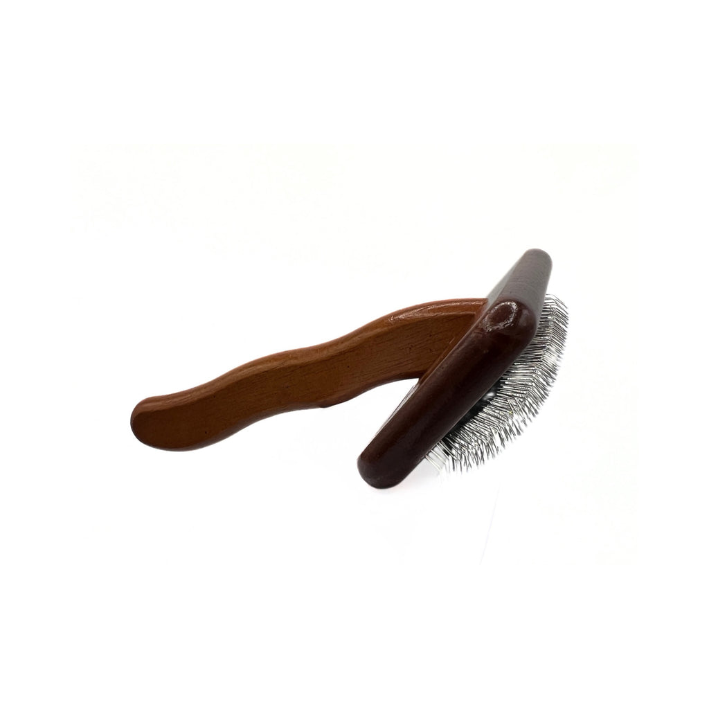 Underside of slicker dog brush showing pin length and cushioned base for comfort